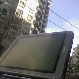 my TC1000, shot on a table, looking up at an apartment building on a sunny day