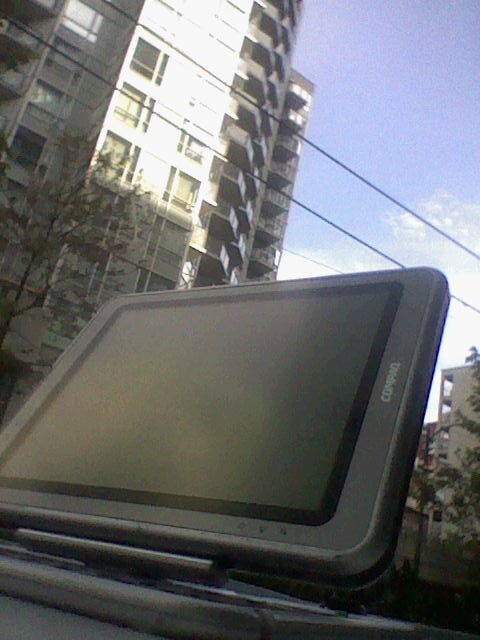 my TC1000, shot on a table, looking up at an apartment building on a sunny day